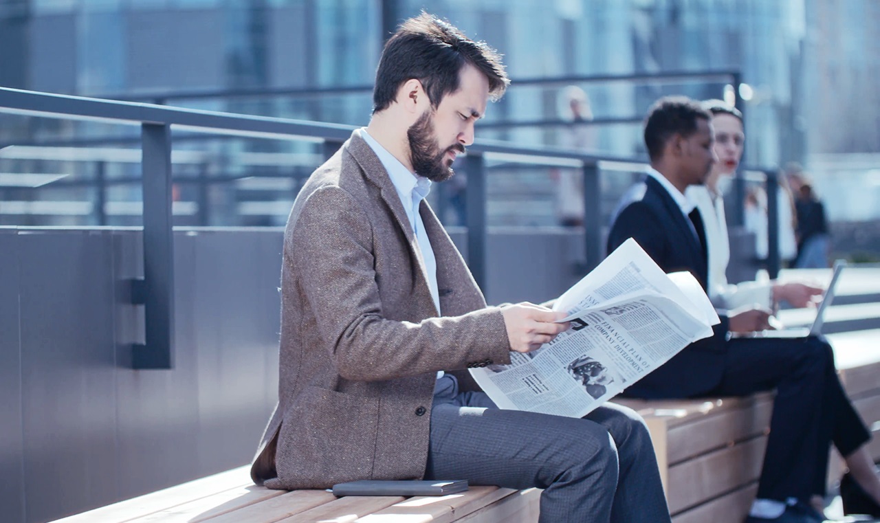 Businessman is reading News.